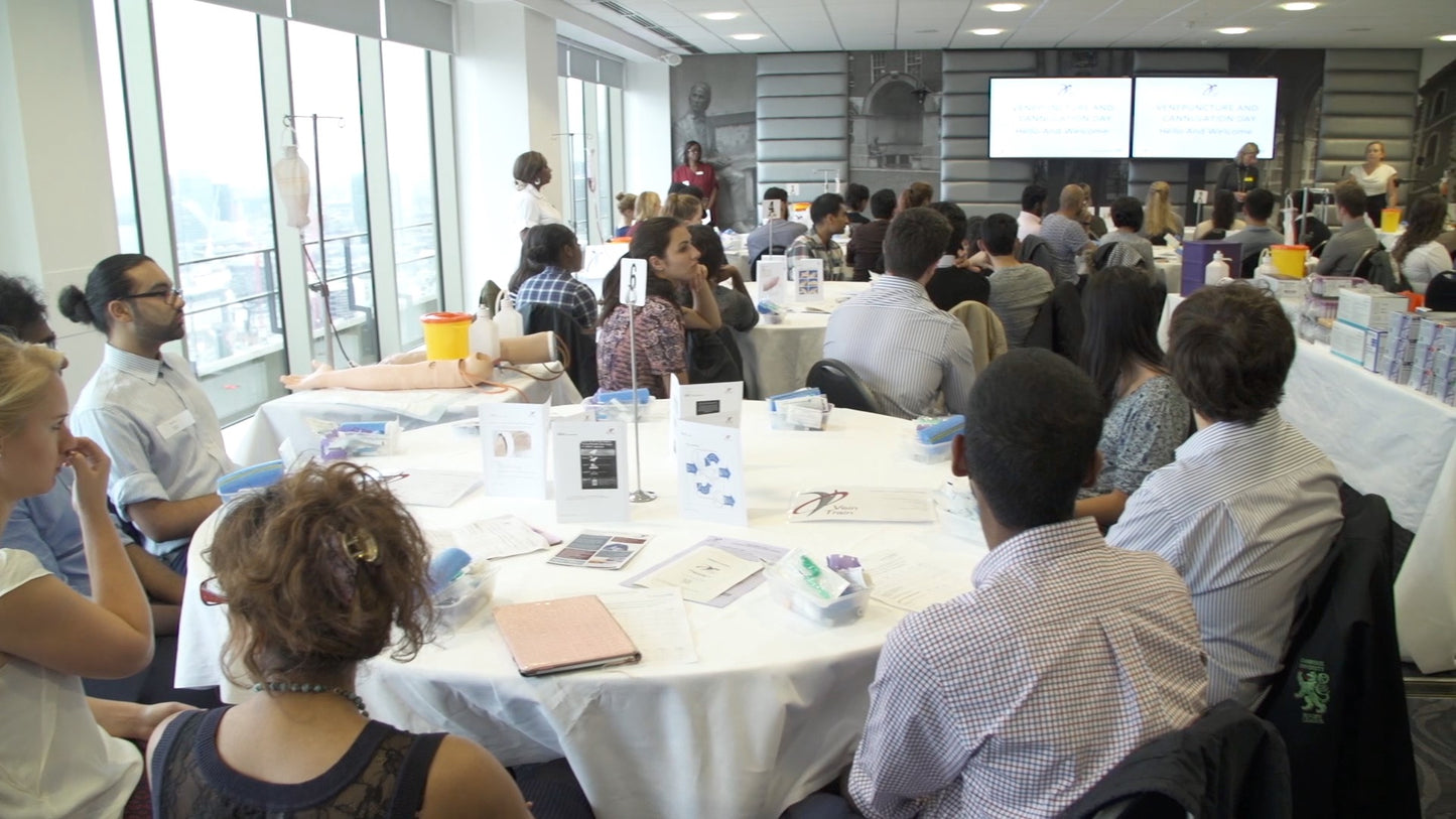 Group of medical students people sitting at tables in a conference room  VeinTrain flat-pack vein simulator for phlebotomy and cannulation training
